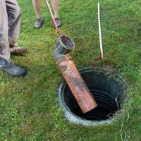 Cleaning and unblocking septic system and draining pipes.